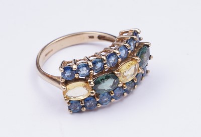 Lot 37 - A topaz and citrine dress ring