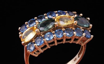 Lot 37 - A topaz and citrine dress ring