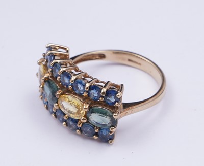 Lot 37 - A topaz and citrine dress ring