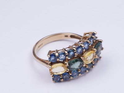 Lot 37 - A topaz and citrine dress ring