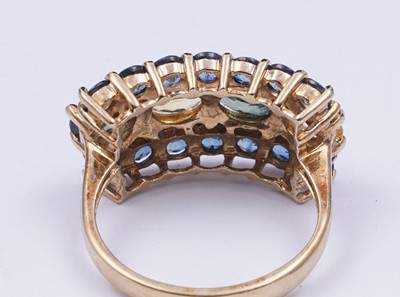 Lot 37 - A topaz and citrine dress ring