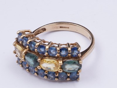 Lot 37 - A topaz and citrine dress ring