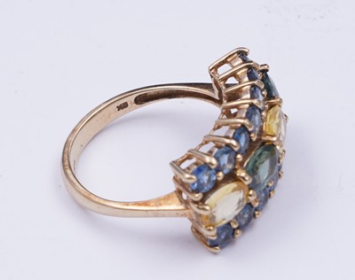 Lot 37 - A topaz and citrine dress ring