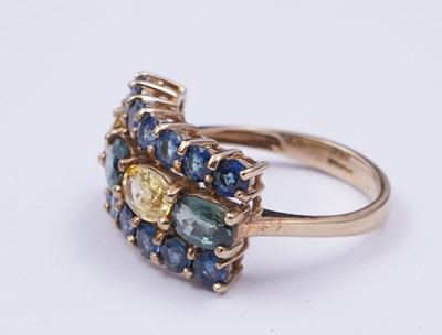 Lot 37 - A topaz and citrine dress ring