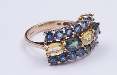 Lot 37 - A topaz and citrine dress ring