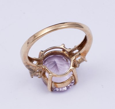 Lot 38 - An amethyst and goshenite dress ring