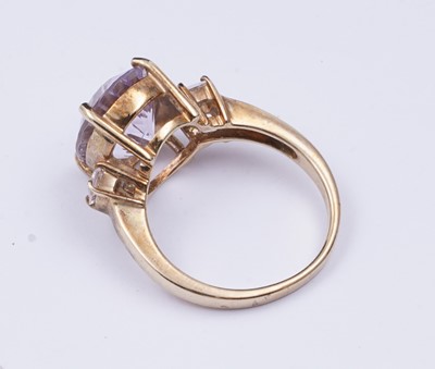 Lot 38 - An amethyst and goshenite dress ring