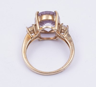 Lot 38 - An amethyst and goshenite dress ring