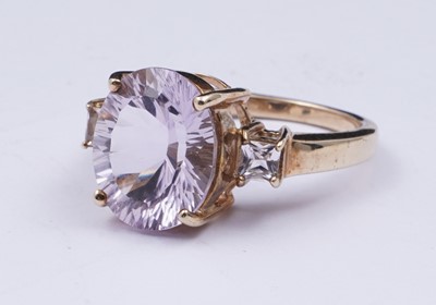 Lot 38 - An amethyst and goshenite dress ring