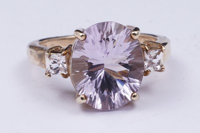 Lot 38 - An amethyst and goshenite dress ring
