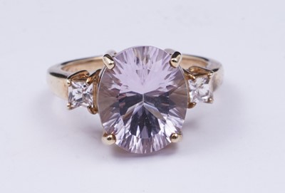 Lot 38 - An amethyst and goshenite dress ring