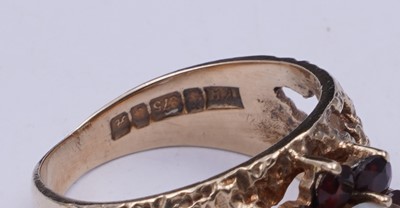Lot 40 - A 1970s opal and garnet bark effect dress ring