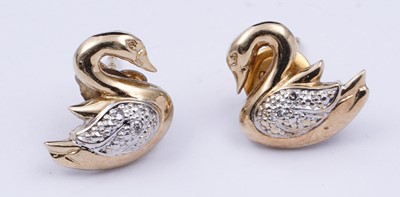Lot 41 - A pair of swan pattern earrings set with diamonds