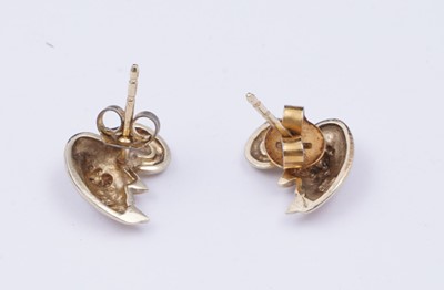 Lot 41 - A pair of swan pattern earrings set with diamonds