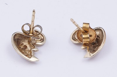 Lot 41 - A pair of swan pattern earrings set with diamonds
