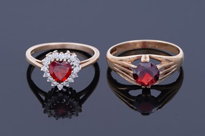 Lot 42 - A red tourmaline love heart ring; and a garnet ring