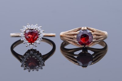 Lot 42 - A red tourmaline love heart ring; and a garnet ring