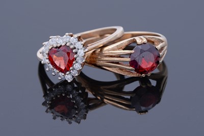 Lot 42 - A red tourmaline love heart ring; and a garnet ring