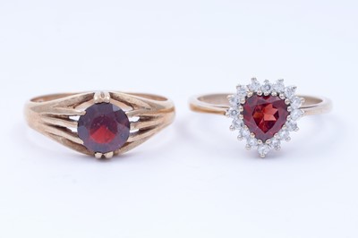 Lot 42 - A red tourmaline love heart ring; and a garnet ring