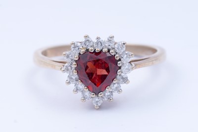 Lot 42 - A red tourmaline love heart ring; and a garnet ring