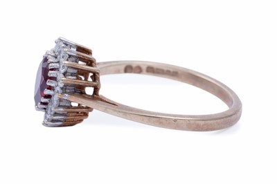Lot 42 - A red tourmaline love heart ring; and a garnet ring