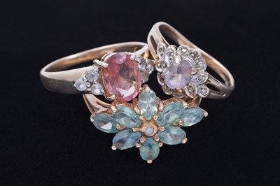 Lot 45 - Three gemstone rings, including a morganite and goshenite three stone ring