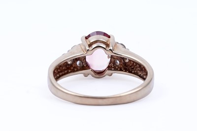 Lot 45 - Three gemstone rings, including a morganite and goshenite three stone ring
