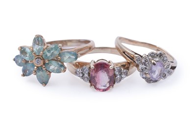 Lot 45 - Three gemstone rings, including a morganite and goshenite three stone ring