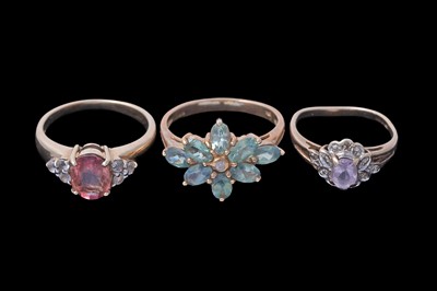 Lot 45 - Three gemstone rings, including a morganite and goshenite three stone ring