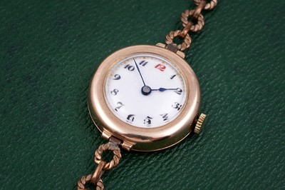 Lot A 1920s lady's 9ct gold cased wristwatch