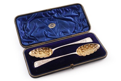 Lot 253 - A cased pair of silver berry spoons
