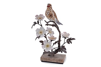 Lot 208 - An Albany Worcester porcelain and bronze Song Thrush perched on bramble