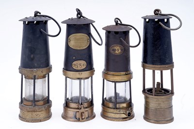 Lot 197 - A collection of four ‘Protector’ type lamps