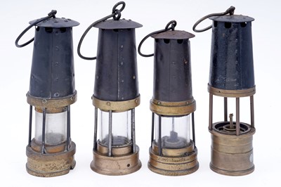 Lot 197 - A collection of four ‘Protector’ type lamps