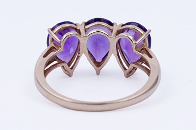 Lot 26 - A contemporary three-stone amethyst ring
