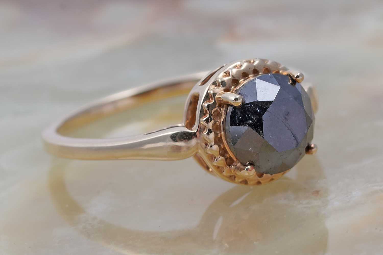 Lot 29 - A single stone black diamond ring