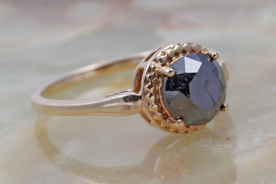 Lot 29 - A single stone black diamond ring