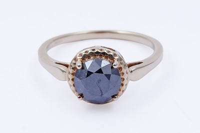 Lot 29 - A single stone black diamond ring