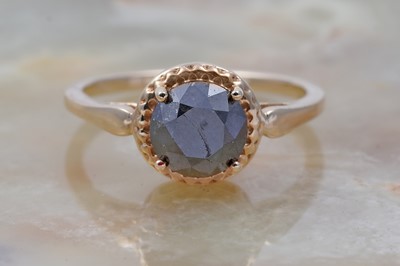 Lot 29 - A single stone black diamond ring