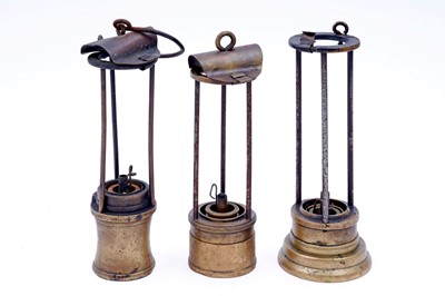 Lot 241 - A collection of three part ‘Davy’ type lamps