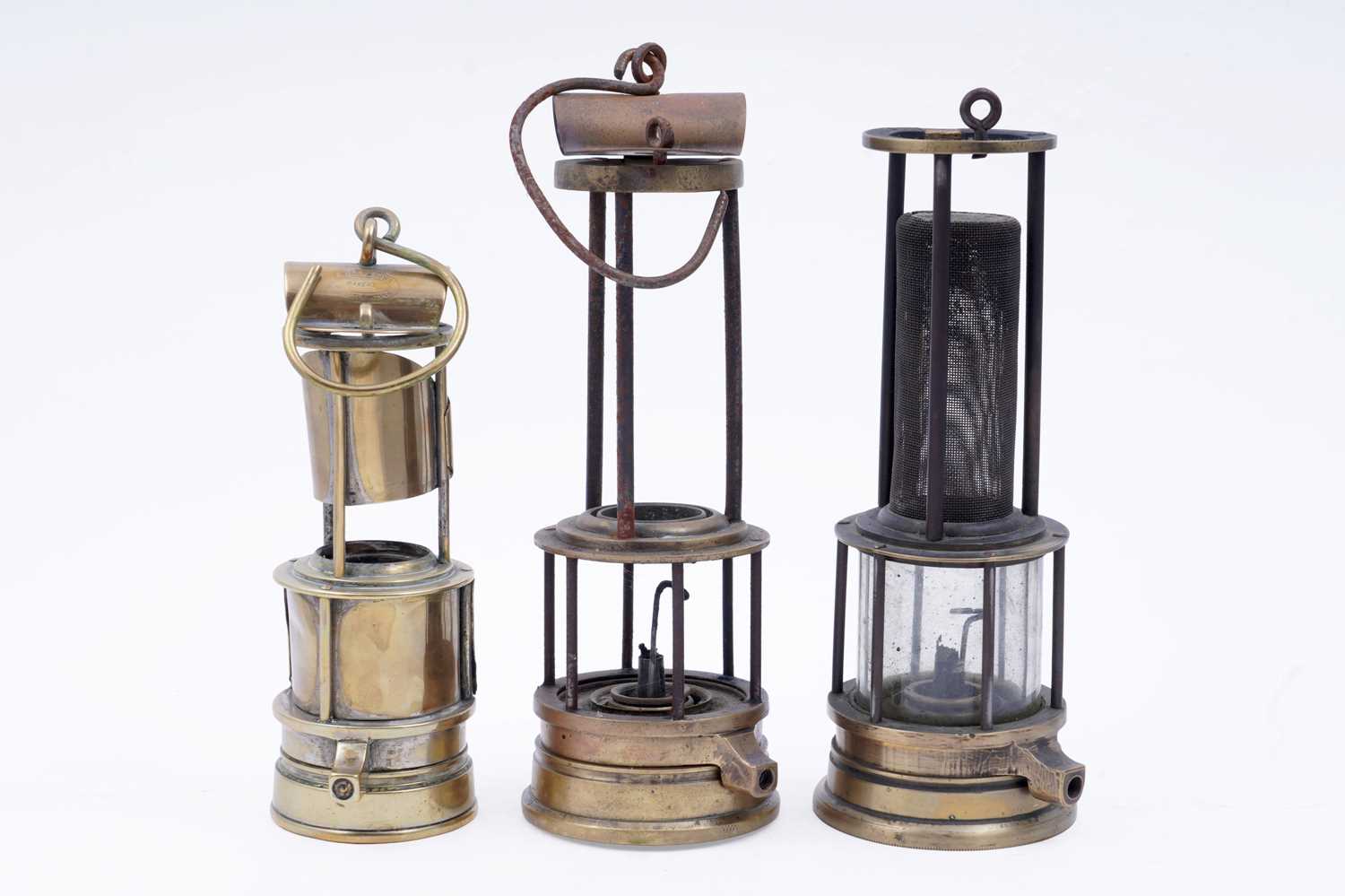 Lot 242 - A collection of three part ‘Clanny’ type lamps