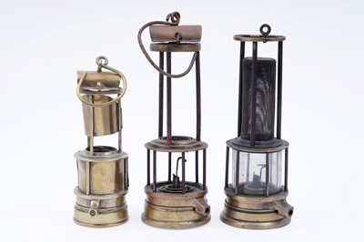 Lot 242 - A collection of three part ‘Clanny’ type lamps