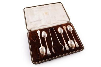 Lot 241 - A cased set of Edwardian silver lace back teaspoons and sugar tongs