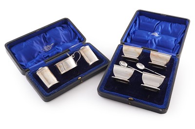 Lot 227 - A cased set of four George V silver salts; and a silver condiment set