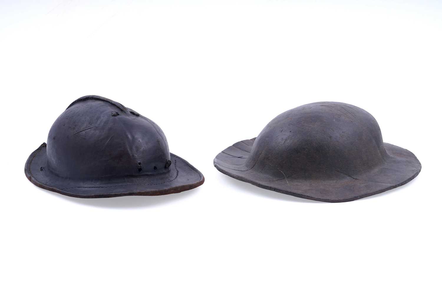 Lot 168 - Two 19th Century formed leather miners' helmets