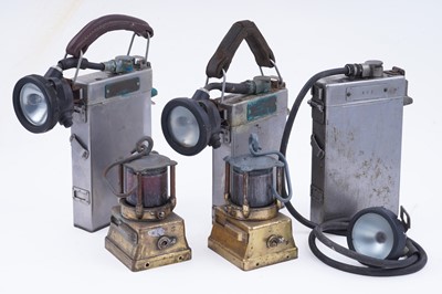 Lot 164 - Three mid-20th Century Alkaline inspection lamps; and two brass-cased signal lamps
