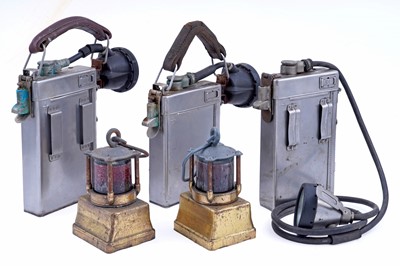 Lot 164 - Three mid-20th Century Alkaline inspection lamps; and two brass-cased signal lamps