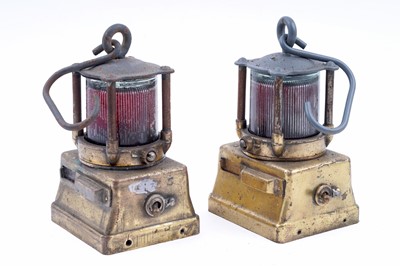 Lot 164 - Three mid-20th Century Alkaline inspection lamps; and two brass-cased signal lamps