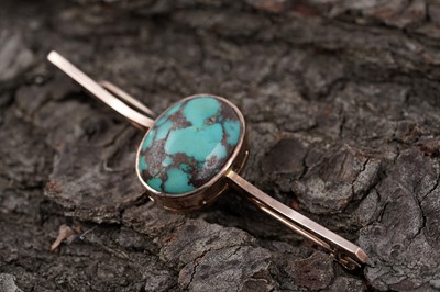 Lot 68 - A 1920s turquoise bar brooch