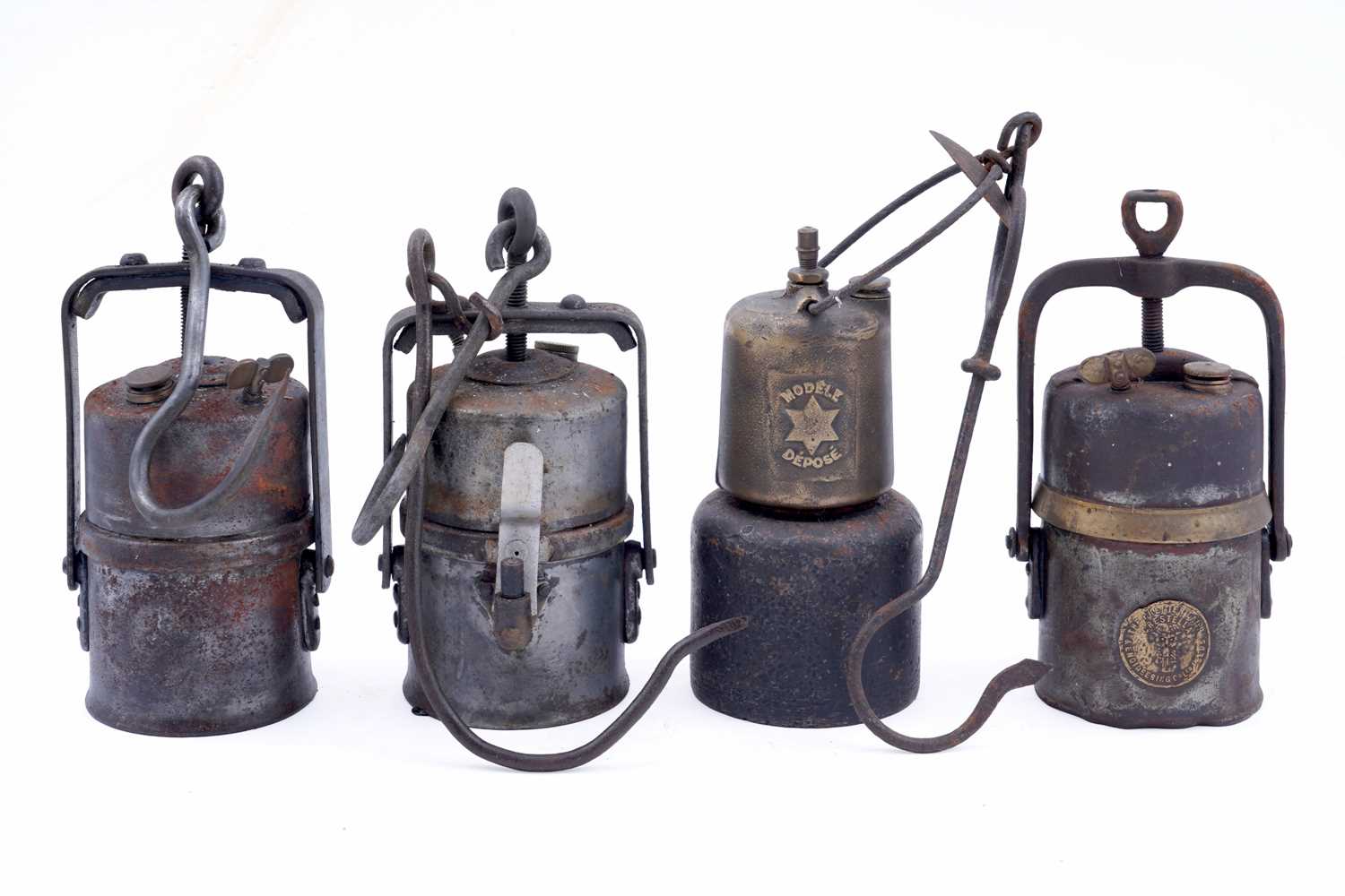 Lot 151 - Four carbide lamps